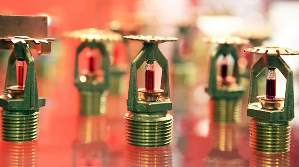 sprinkler system heads lined up