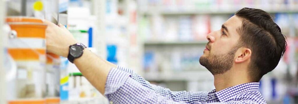 man looking for materials to DIY - fixing crack in the wall by yourself .