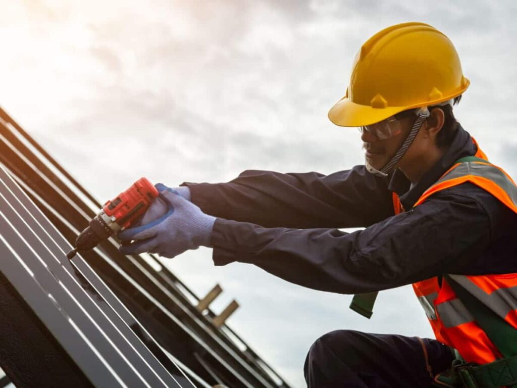 Man installing Eco-Friendly Roof
