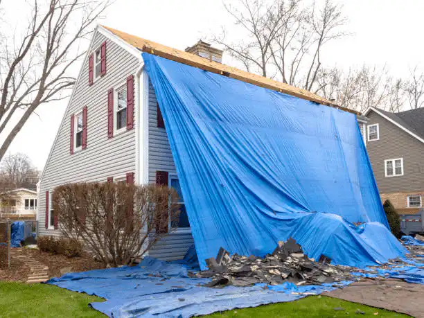 Emergency siding tarp