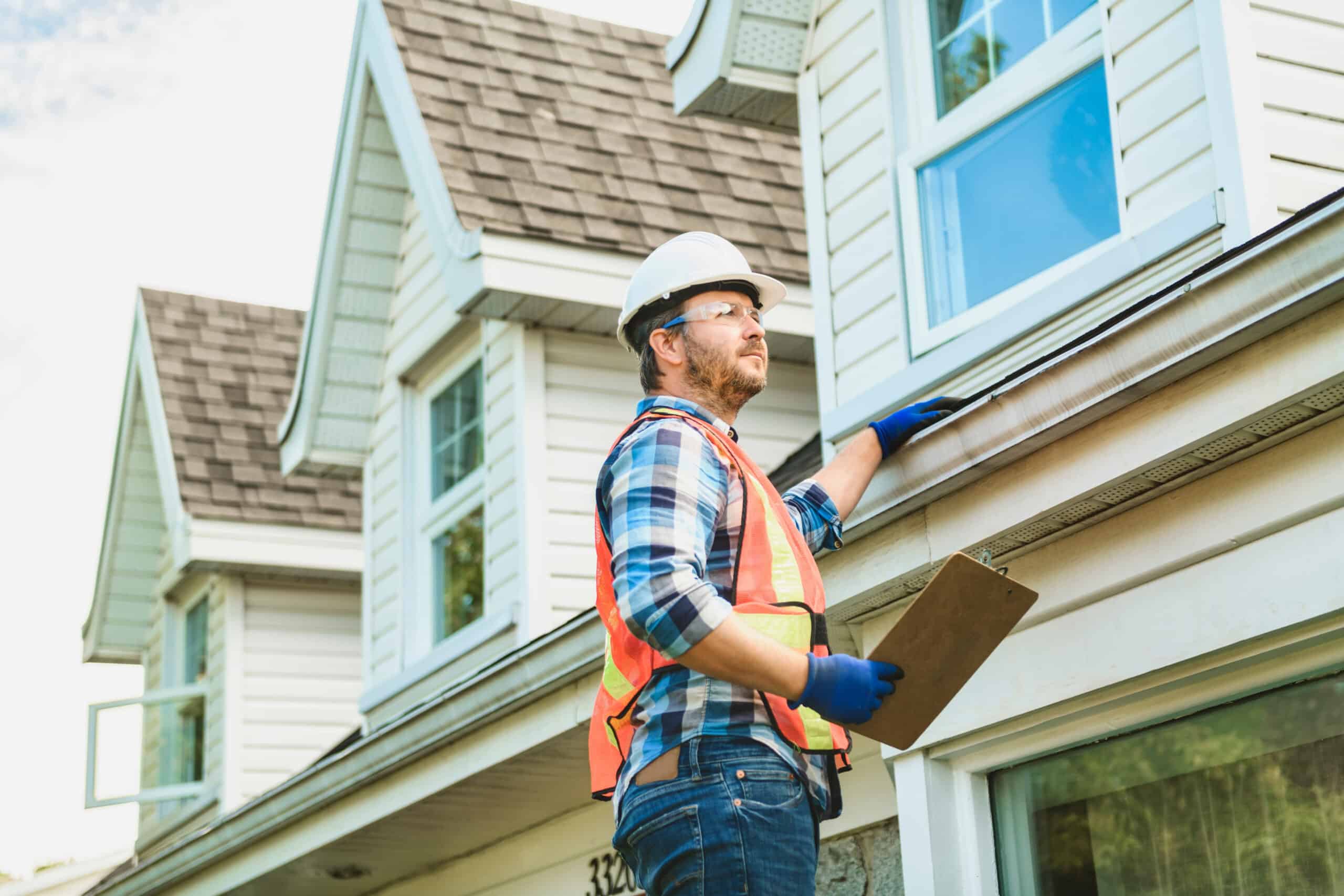 person repairing residential roof